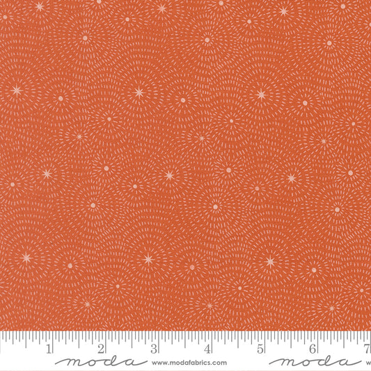 Pattern of concentric circles and stars on a clay background from Night Owl by Gingiber for Moda Fabrics.